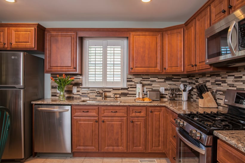 Kitchen Remodel with Tile Backsplash and Cherry Cabinets