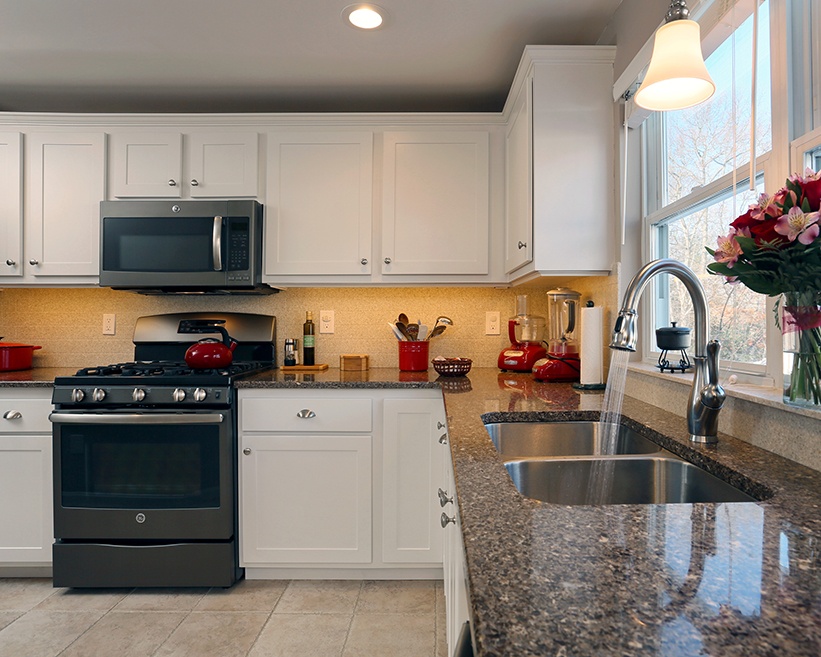 White Kitchen with Under-Cabinet Lighting