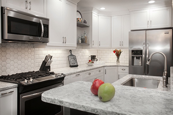Kitchen with White Cabinets, Subway Tile, and Honeycomb Backsplash 