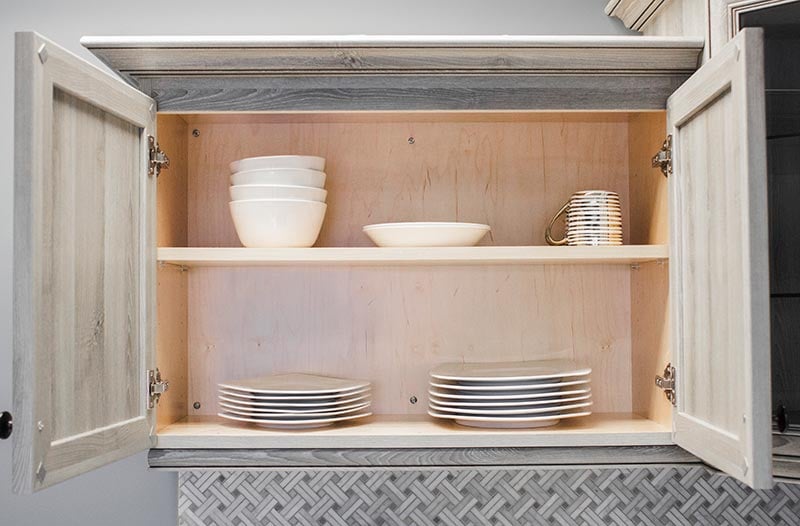 inside a lighted kitchen cabinet