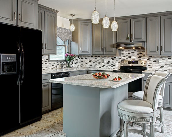 An island adds extra kitchen counter space to an L-shaped kitchen